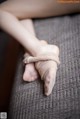 A close up of a person's feet tied up with a bandage.