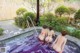 A group of women in bikinis sitting in a hot tub.